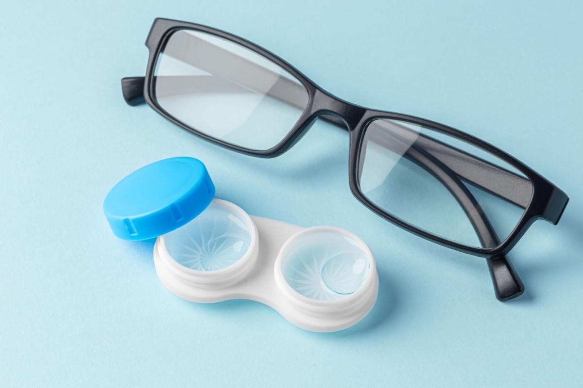 glasses and contact lens next to each other